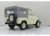 1967 Toyota Landcruiser FJ40 with closed soft top. beige/grey